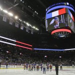 The Arizona Coyotes and the New York Islanders stand on the ice during the singing of the French and American national anthems before an NHL hockey game Monday, Nov. 16, 2015, in New York. The Islanders won the game 5-2. (AP Photo/Frank Franklin II)