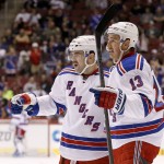 New York Rangers' Kevin Hayes (13) celebrates his goal against the Arizona Coyotes with teammate Keith Yandle, left, during the second period of an NHL hockey game against the Arizona Coyotes, Saturday, Nov. 7, 2015, in Glendale, Ariz. (AP Photo/Ross D. Franklin)