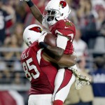 Arizona Cardinals wide receiver J.J. Nelson (14) celebrates his touchdown with Darren Fells (85) during the second half of an NFL football game against the Cincinnati Bengals, Sunday, Nov. 22, 2015, in Glendale, Ariz. (AP Photo/Rick Scuteri)