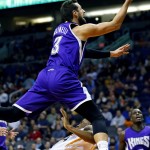 Sacramento Kings' Marco Belinelli, of Italy, is fouled by Phoenix Suns' Ronnie Price during the first half of an NBA basketball game, Wednesday, Nov. 4, 2015, in Phoenix. (AP Photo/Matt York)