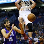 Phoenix Suns' Alex Len (21) dunks over Sacramento Kings' Omri Casspi, of Israel, during the second half of an NBA basketball game, Wednesday, Nov. 4, 2015, in Phoenix. (AP Photo/Matt York)