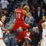 New Orleans Pelicans guard Eric Gordon (10) shoots against the Phoenix Suns in the first half of an NBA basketball game in New Orleans, Sunday, Nov. 22, 2015. (AP Photo/Max Becherer)