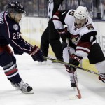 Columbus Blue Jackets' Cody Goloubef, left, tries to steal the puck from Arizona Coyotes' Tobias Rieder during the first period of an NHL hockey game, Saturday, Nov. 14, 2015, in Columbus, Ohio. (AP Photo/Jay LaPrete)