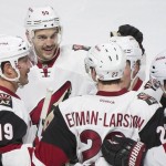 Arizona Coyotes' Oliver Ekman-Larsson (23) celebrates with teammates Shane Doan (19), Antoine Vermette (50) and Mikkel Boedker (89) after scoring against the Montreal Canadiens during the second period of an NHL hockey game in Montreal, Thursday, Nov. 19, 2015. (Graham Hughes/The Canadian Press via AP) MANDATORY CREDIT