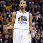 Golden State Warriors guard Stephen Curry reacts after scoring a three-point basket in the first quarter during an NBA basketball game against the Phoenix Suns, Friday, Nov. 27, 2015, in Phoenix. (AP Photo/Rick Scuteri)