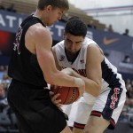 Santa Clara forward Nate Kratch, left, ties up the ball with Arizona center Dusan Ristic, right, during the first half of an NCAA college basketball game in the quarterfinals of the Wooden Legacy tournament in Fullerton, Calif., Thursday, Nov. 26, 2015. (AP Photo/Alex Gallardo)
