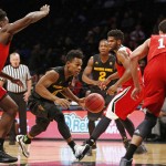 Arizona State guard Tra Holder (0) drives through heavy traffic in the first half of a Legends Classic semifinal against North Carolina State in an NCAA college basketball game Monday, Nov. 23, 2015, in New York.  (AP Photo/Kathy Willens)