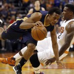 Phoenix Suns guard Eric Bledsoe (2) fouls New Orleans Pelicans guard Ish Smith in the first quarter during an NBA basketball game, Wednesday, Nov. 25, 2015, in Phoenix. (AP Photo/Rick Scuteri)