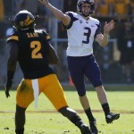 Washington's Jake Browning (3) gets off a pass as Arizona State's Christian Sam (2) applies defensive pressure during the first half of an NCAA college football game Saturday, Nov. 14, 2015, in Tempe, Ariz. (AP Photo/Ross D. Franklin)