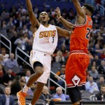 Phoenix Suns guard Brandon Knight (3) shoots over Chicago Bulls guard Jimmy Butler (21) during the second half of an NBA basketball game Wednesday, Nov. 18, 2015, in Phoenix. (AP Photo/Matt York)