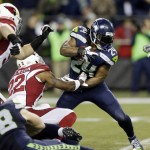 Seattle Seahawks running back Marshawn Lynch (24) rushes as Arizona Cardinals strong safety Tony Jefferson (22) attempts the tackle in the first half of an NFL football game Sunday, Nov. 15, 2015, in Seattle. (AP Photo/Stephen Brashear)