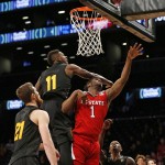 Arizona State forward Savon Goodman (11) defends as North Carolina State forward Lennard Freeman (1) goes up for a layup in the second half of an NCAA college basketball game in the Legends Classic semifinal Monday, Nov. 23, 2015, in New York. Arizona State defeated North Carolina State 79-76. (AP Photo/Kathy Willens)