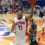 Arizona guard Allonzo Trier, left, defends as Providence guard Kyron Cartwright defends during the first half of an NCAA college basketball game at the Wooden Legacy tournament, Friday, Nov. 27, 2015, in Fullerton, Calif. (AP Photo/Mark J. Terrill)