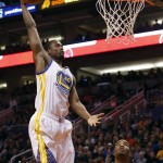 Golden State Warriors forward Harrison Barnes (40) scores against the Phoenix Suns in the second quarter during an NBA basketball game, Friday, Nov. 27, 2015, in Phoenix. (AP Photo/Rick Scuteri)