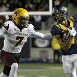 California wide receiver Trevor Davis, right, runs from Arizona State defensive back Solomon Means during the first half of an NCAA college football game in Berkeley, Calif., Saturday, Nov. 28, 2015. (AP Photo/Jeff Chiu)