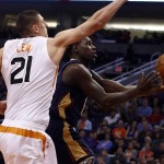 New Orleans Pelicans guard Ish Smith, right, drives past Phoenix Suns center Alex Len (21) in the second quarter during an NBA basketball game, Wednesday, Nov. 25, 2015, in Phoenix. (AP Photo/Rick Scuteri)