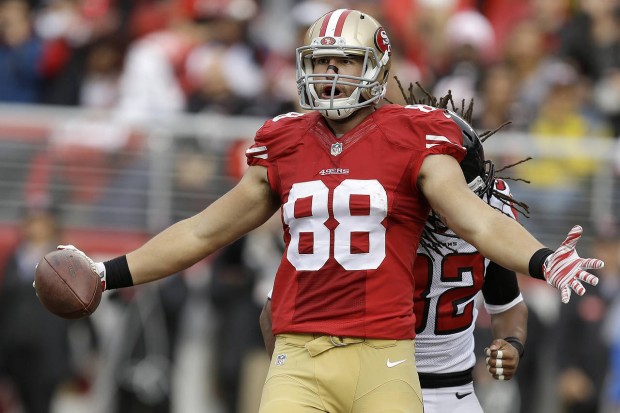 San Francisco 49ers tight end Garrett Celek (88) celebrates after catching a touchdown pass in front of Atlanta Falcons cornerback Jalen Collins during the first half of an NFL football game in Santa Clara, Calif., Sunday, Nov. 8, 2015. (AP Photo/Ben Margot)