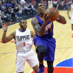 Phoenix Suns guard Eric Bledsoe, right, goes up for a shot as Los Angeles Clippers guard Chris Paul defends during the first half of an NBA basketball game, Monday, Nov. 2, 2015, in Los Angeles. (AP Photo/Mark J. Terrill)
