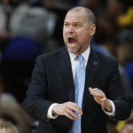 Denver Nuggets head coach Michael Malone directs his team against the Phoenix Suns in the first half of an NBA basketball game Friday, Nov. 20, 2015, in Denver. (AP Photo/David Zalubowski)