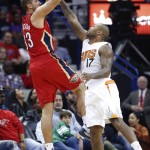 New Orleans Pelicans forward Ryan Anderson (33) shoots from from the 3-point line against Phoenix Suns forward P.J. Tucker in the first half of an NBA basketball game in New Orleans, Sunday, Nov. 22, 2015. (AP Photo/Max Becherer)