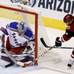 New York Rangers' Antti Raanta (32), of Finland, makes a save on a shot by Arizona Coyotes' Tobias Rieder (8), of Germany, during the first period of an NHL hockey game Saturday, Nov. 7, 2015, in Glendale, Ariz. (AP Photo/Ross D. Franklin)