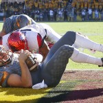 Arizona State quarterback Mike Bercovici (2) falls into the end zone for a touchdown during the first half of an NCAA college football game against Arizona, Saturday, Nov. 21, 2015, in Tempe, Ariz. (AP Photo/Matt York)