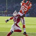 Cleveland Browns tight end Gary Barnidge (82) catches a 3-yard touchdown pass under pressure from Arizona Cardinals strong safety Tony Jefferson (22) in the first half of an NFL football game, Sunday, Nov. 1, 2015, in Cleveland. (AP Photo/Ron Schwane)