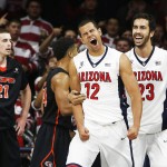 Arizona forward Ryan Anderson (12) reacts with Mark Tollefsen after scoring during the first half of an NCAA college basketball game against Pacific, Friday, Nov. 13, 2015, in Tucson, Ariz. (AP Photo/Rick Scuteri)