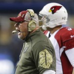 Arizona Cardinals coach Bruce Arians yells as he stands next to quarterback Carson Palmer during the first half of an NFL football game against the Seattle Seahawks, Sunday, Nov. 15, 2015, in Seattle. (AP Photo/Stephen Brashear)