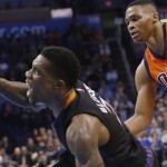 Phoenix Suns guard Eric Bledsoe (2) looses the ball as he fouled by Oklahoma City Thunder guard Russell Westbrook (0) in the second quarter of an NBA basketball game in Oklahoma City, Sunday, Nov. 8, 2015. (AP Photo/Sue Ogrocki)