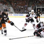 Anaheim Ducks' Chris Wagner, left, shoots under pressure by Arizona Coyotes' Zbynek Michalek, of the Czech Republic, during the second period of an NHL hockey game, Monday, Nov. 9, 2015, in Anaheim, Calif. (AP Photo/Jae C. Hong)