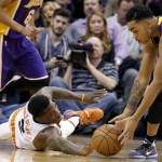 Los Angeles Lakers' D'Angelo Russell, right, takes the ball away from Phoenix Suns' Eric Bledsoe, left, during the first half of an NBA basketball game Monday, Nov. 16, 2015, in Phoenix. (AP Photo/Ross D. Franklin)
