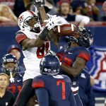 Utah wide receiver Tyrone Smith (81) and Arizona cornerback Jarvis McCall Jr. battle for the ball during the first half of an NCAA college football game, Saturday, Nov. 14, 2015, in Tucson, Ariz. (AP Photo/Rick Scuteri)
