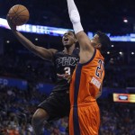 Phoenix Suns guard Brandon Knight (3) shoots as Oklahoma City Thunder guard Andre Roberson (21) defends in the first quarter of an NBA basketball game in Oklahoma City, Sunday, Nov. 8, 2015. (AP Photo/Sue Ogrocki)