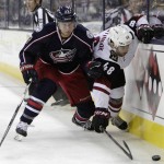 Arizona Coyotes' Jordan Martinook, right, and Columbus Blue Jackets' Ryan Murray chase a loose puck during the first period of an NHL hockey game, Saturday, Nov. 14, 2015, in Columbus, Ohio. (AP Photo/Jay LaPrete)