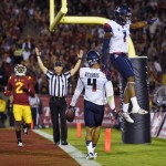 Arizona wide receiver David Richards, second from right, celebrates with wide receiver Cayleb Jones, right, after making a touchdown catch as Southern California cornerback Adoree' Jackson watches during the first half of an NCAA college football game, Saturday, Nov. 7, 2015, in Los Angeles. (AP Photo/Mark J. Terrill)