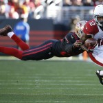 Arizona Cardinals wide receiver John Brown (12) evades a tackle-attempt by San Francisco 49ers cornerback Kenneth Acker (20) during the first half of an NFL football game in Santa Clara, Calif., Sunday, Nov. 29, 2015. (AP Photo/Tony Avelar)