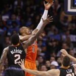 Oklahoma City Thunder guard Russell Westbrook (0) is fouled by Phoenix Suns guard Eric Bledsoe (2) as he shoots in the second quarter of an NBA basketball game in Oklahoma City, Sunday, Nov. 8, 2015. (AP Photo/Sue Ogrocki)