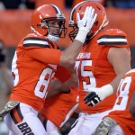 Cleveland Browns guard Joel Bitonio (75) congratulates wide receiver Brian Hartline (83) after Hartline caught a 10-yard touchdown pass in the first half of an NFL football game against the Arizona Cardinals, Sunday, Nov. 1, 2015, in Cleveland. (AP Photo/David Richard)