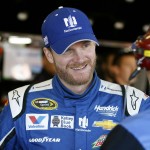 Dale Earnhardt Jr. talks with crew members before a practice session for Sunday's NASCAR Sprint Cup Series auto race at Phoenix International Raceway, Saturday, Nov. 14, 2015 in Avondale, Ariz. (AP Photo/Ralph Freso)