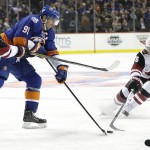 New York Islanders' John Tavares (91) and Arizona Coyotes' Max Domi (16) fight for control of the puck during the second period of an NHL hockey game Monday, Nov. 16, 2015, in New York. (AP Photo/Frank Franklin II)
