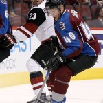 Colorado Avalanche's Alex Tanguay (40) controls the puck in front of Arizona Coyotes' Oliver Ekman-Larsson (23), of Sweden, during the first period of an NHL hockey game Thursday, Nov. 5, 2015, in Glendale, Ariz. (AP Photo/Ross D. Franklin)