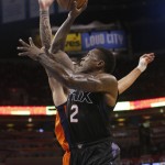 Phoenix Suns guard Eric Bledsoe (2) shoots in front of Oklahoma City Thunder center Steven Adams, rear, in the second quarter of an NBA basketball game in Oklahoma City, Sunday, Nov. 8, 2015. (AP Photo/Sue Ogrocki)