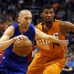 Detroit Pistons guard Steve Blake, left, drives past Phoenix Suns guard Ronnie Price (14) in the second quarter during an NBA basketball game, Friday, Nov. 6, 2015, in Phoenix. (AP Photo/Rick Scuteri)