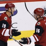 Arizona Coyotes' Shane Doan (19) celebrates his goal against the Edmonton Oilers with teammate Max Domi (16) during the second period of an NHL hockey game Thursday, Nov. 12, 2015, in Glendale, Ariz. (AP Photo/Ross D. Franklin)