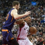 Toronto Raptors' Kyle Lowry, right, drives past Phoenix Suns' Jon Leuer during the first half of an NBA basketball game in Toronto on Sunday, Nov. 29, 2015. (Darren Calabrese/The Canadian Press via AP) MANDATORY CREDIT