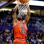Chicago Bulls guard Jimmy Butler (21) dunks against the Phoenix Suns during the first half of an NBA basketball game Wednesday, Nov. 18, 2015, in Phoenix. (AP Photo/Matt York)
