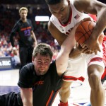 Boise State forward Nick Duncan, left, and Arizona guard Allonzo Trier battle for a loose ball during the second half of an NCAA college basketball game, Thursday, Nov. 19, 2015, in Tucson, Ariz. (AP Photo/Rick Scuteri)