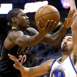 Phoenix Suns guard Archie Goodwin (20) drives on Golden State Warriors guard Klay Thompson during the third quarter during an NBA basketball game, Friday, Nov. 27, 2015, in Phoenix. The Warriors won 135-116. (AP Photo/Rick Scuteri)