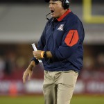 Arizona coach Rich Rodriguez yells to his team during the first half of an NCAA college football game against Southern California, Saturday, Nov. 7, 2015, in Los Angeles. (AP Photo/Mark J. Terrill)